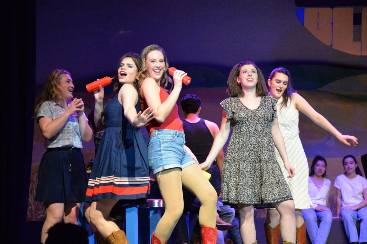 Elizabeth Diehl, who plays Ariel Moore in Footloose, performs the dance number “Holding Out for a Hero” during a dress rehearsal.