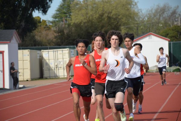 Senior Jake Ramirez sprints to the finish line during the boys’ varsity 800 meter race against athletes from Half Moon Bay and South San Francisco High School. 
