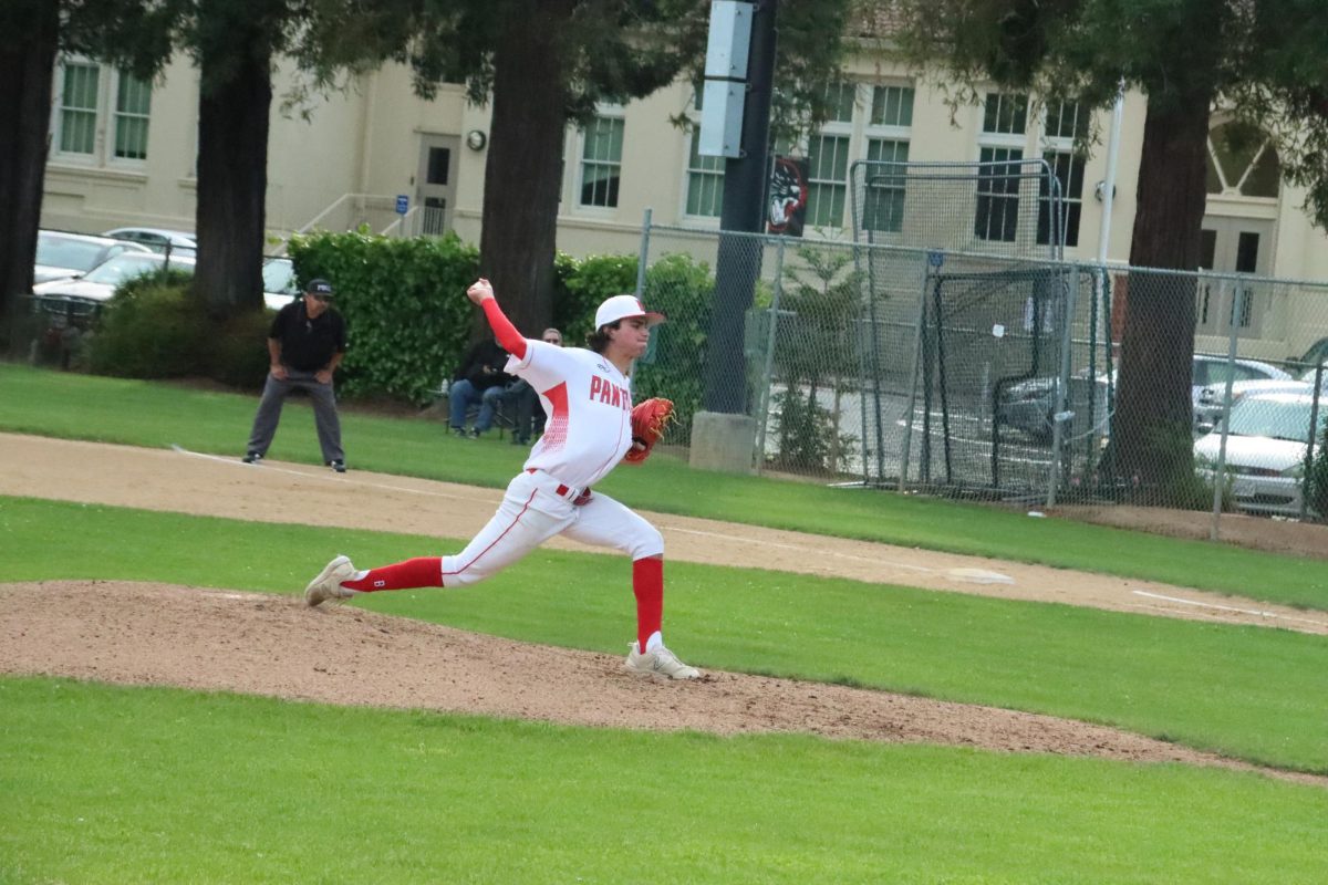 Junior Dionisios Vorrises deals to the plate in the sixth inning of varsity baseball’s matchup against Menlo-Atherton on April 17. 