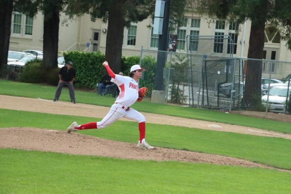 Junior Dionisios Vorrises deals to the plate in the sixth inning of varsity baseball’s matchup against Menlo-Atherton on April 17. 
