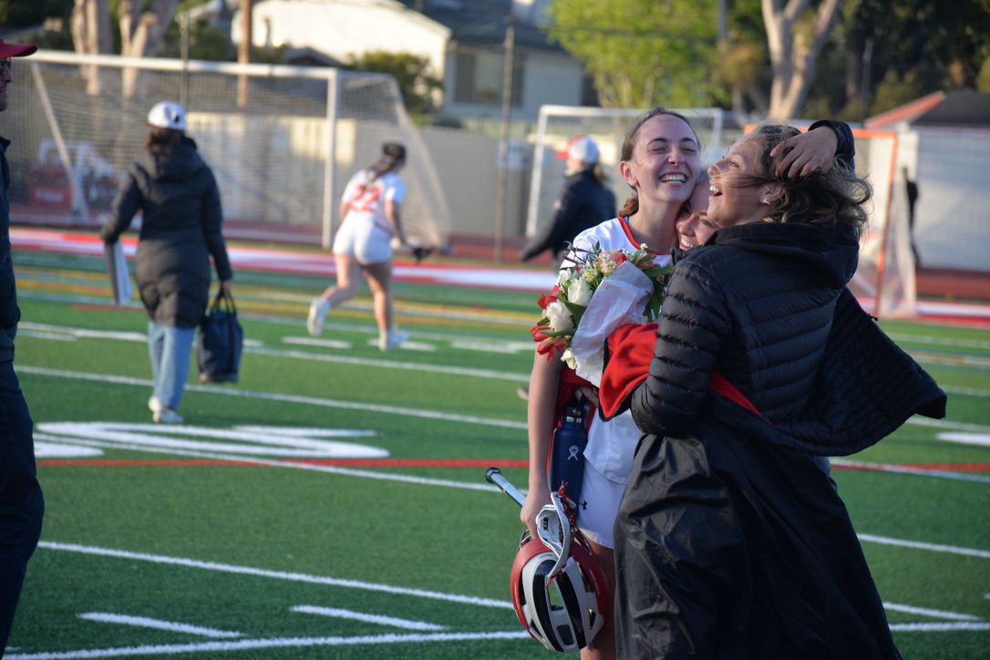 Senior captain Gigi Bottarini embraces her family after the game.