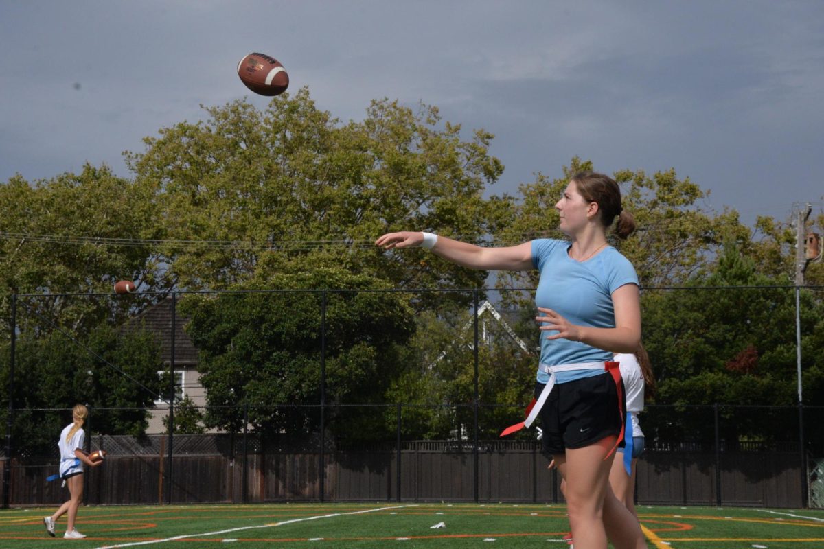 Senior Louann Bernaudin tosses the ball during their practice on Aug. 23.