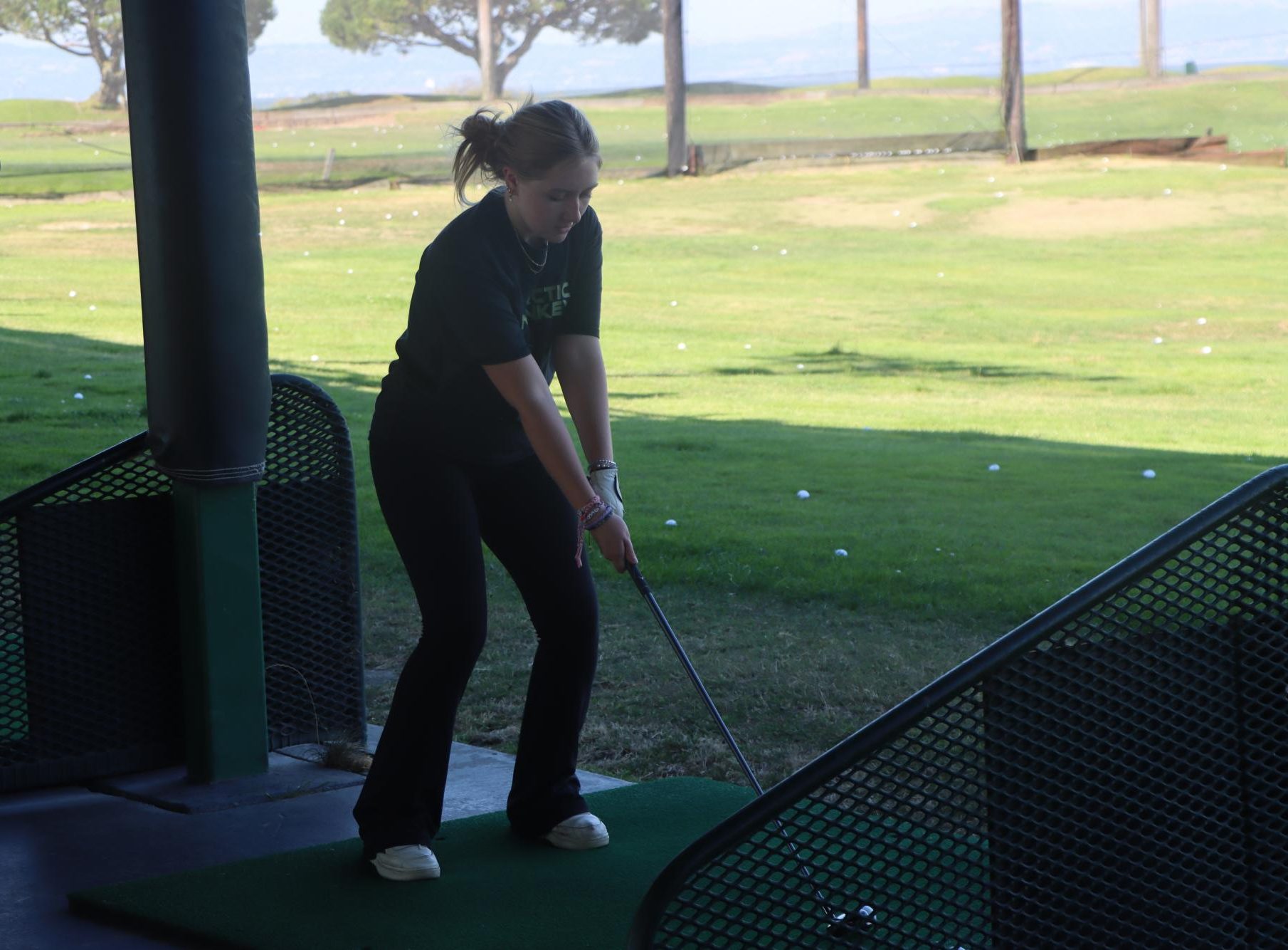 Senior Ali Moran practicing at the driving range at a practice on September 3. 