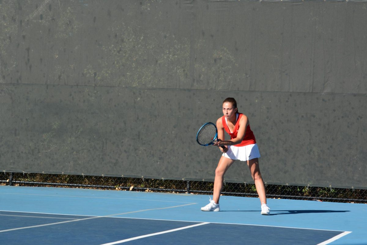 Senior Lexi Podkaminer prepares to receive a serve on Oct. 10 at the match against Carlmont. 