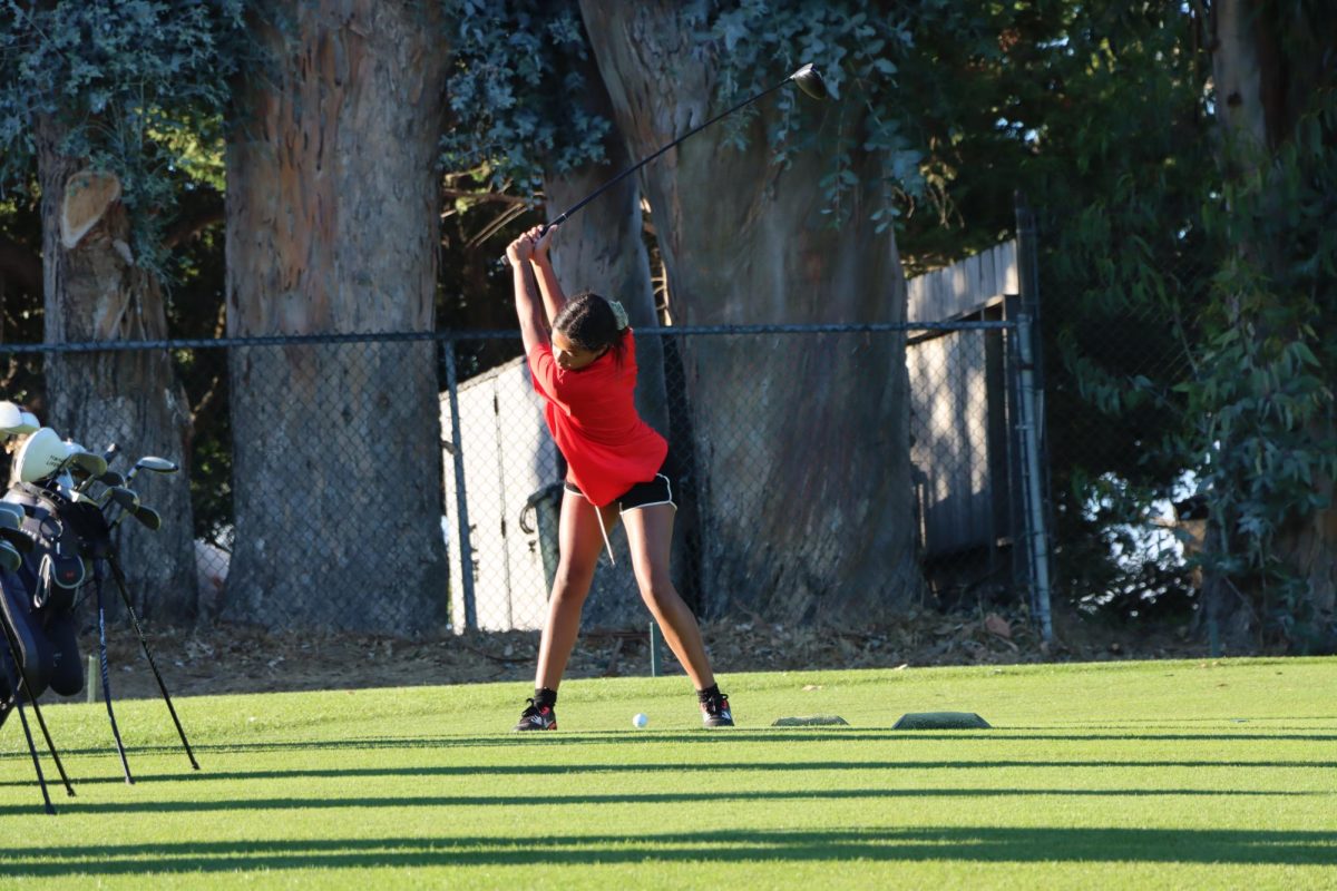 Sophomore Sharon Sims tees off on the seventh hole on Wednesday, Oct. 16. 