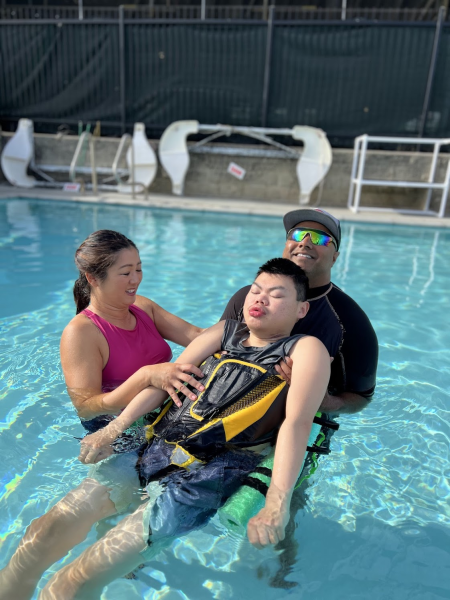 Adapted physical education (P.E.) specialist Jeff Torres and physical therapist Angel Hsieh support Bay University student Ryan Chew during his weekly pool exercise, helping him move more freely in the water.