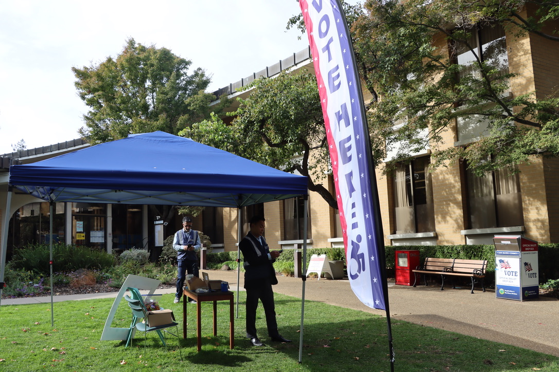 Students work at polling stations on election day