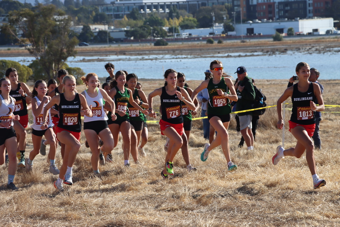 Girls varsity kicks off their race with junior Stella Newman leading the pack.