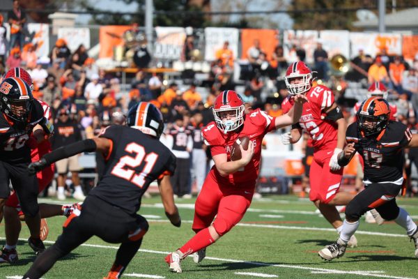 Senior running back Lucas Kirk jukes out a defender during his 103 yard performance.