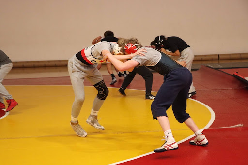 Senior Quinn Jones and junior Miles Reeth wrestle during practice on Friday, Nov. 15.