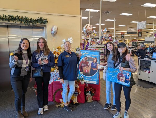 Members of the Key Club volunteer at a Safeway event in partnership with National Broadcasting Company encouraging shoppers to donate to nourishing neighbors.