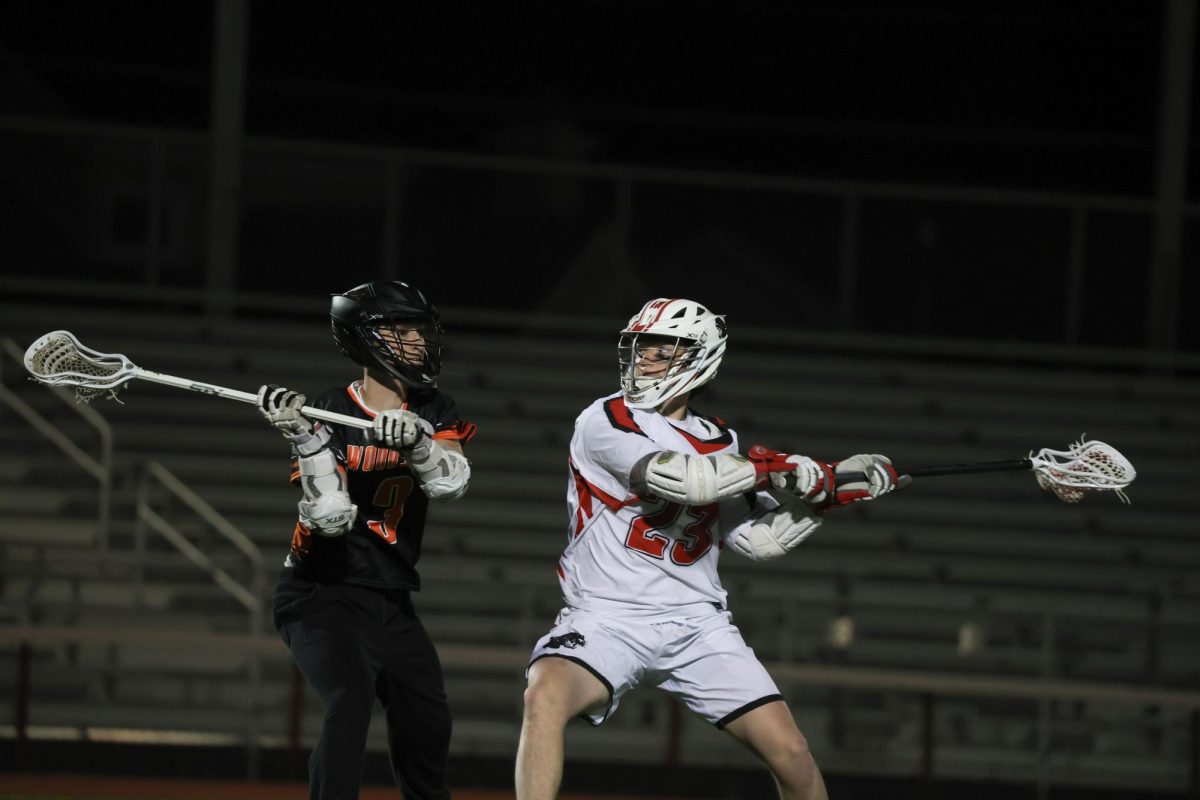 Senior midfielder and team captain Henry Bradley winds up for a shot. Bradley scored three goals on March 20 against Woodside. 