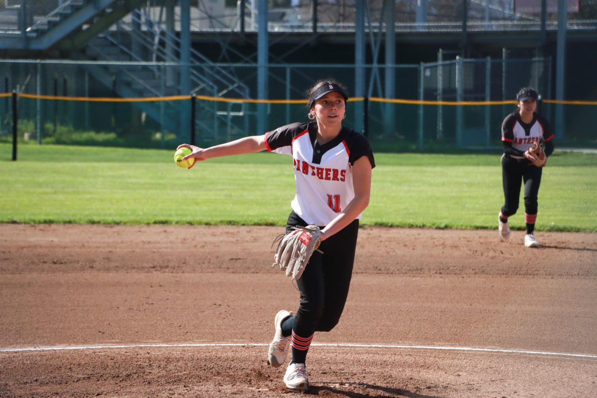 Senior pitcher Amalia Alfers pitches to the Carlmont batter in the first inning of their game on Tuesday, March 18.