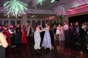Students gather on the dance floor during Pride Prom, celebrating in an atmosphere designed to be welcoming and inclusive for all.