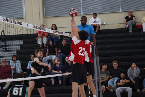 Seniors CJ Reed and Cole Ng block an attack from Christopher during a match on Monday, May 12.