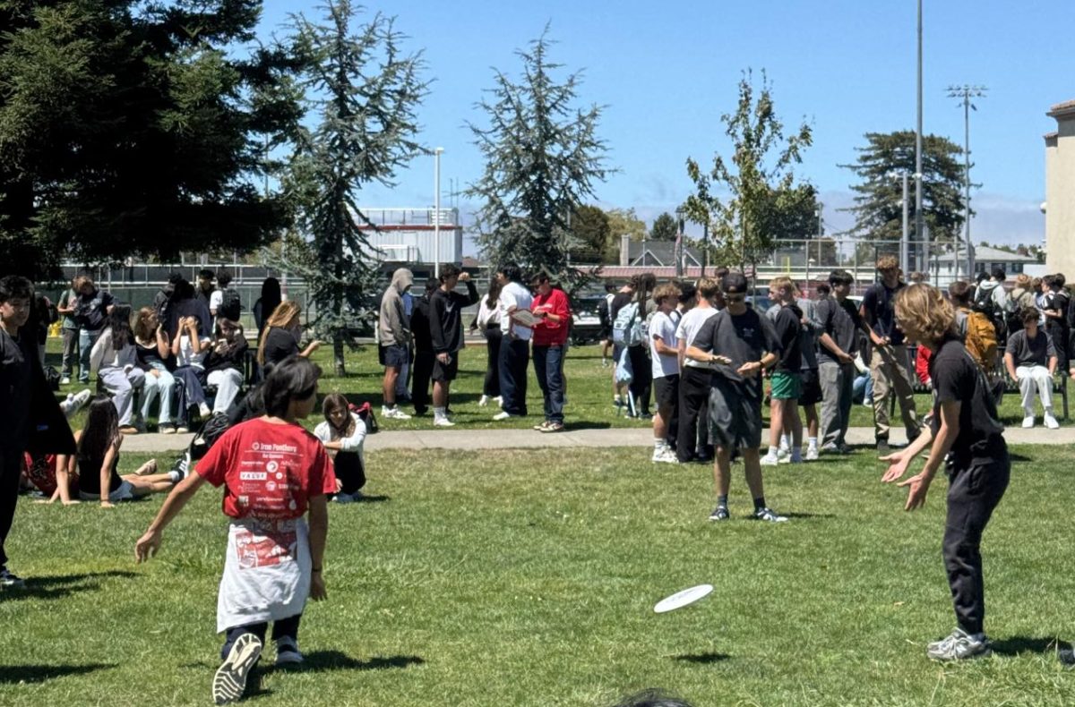 During the Aug.15 fire evacuation, some students played frisbee on the front lawn to pass the time. 