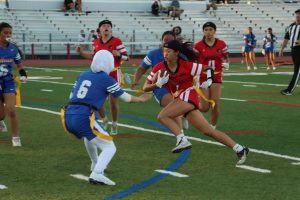 Freshman Chloe Chew carries the ball towards the endzone in an attempt to score.