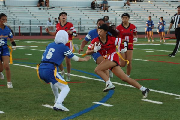 Freshman Chloe Chew carries the ball towards the endzone in an attempt to score.