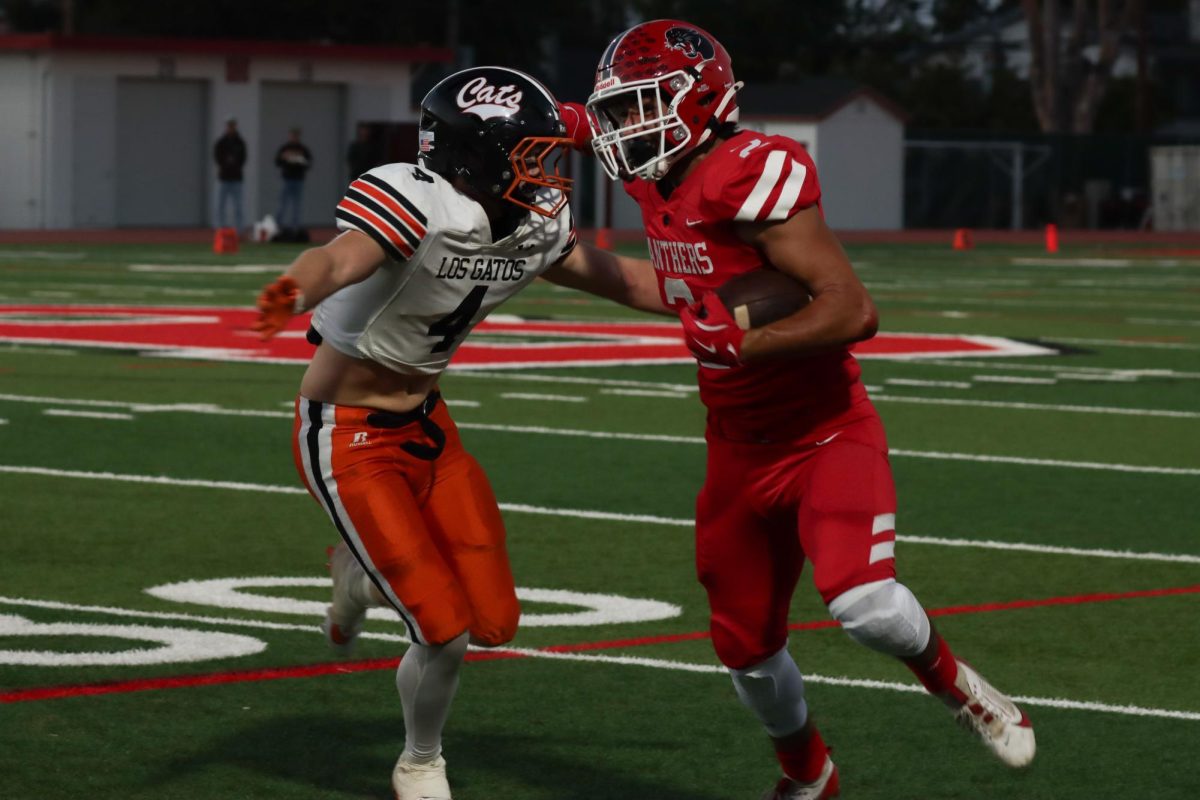 Senior running back Hayden Haba fights off a Los Gatos defender.