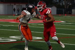 Senior running back Hayden Haba fights off a Los Gatos defender.