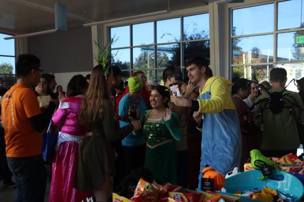 Students, staff, and families socialized and danced in their Halloween costumes.