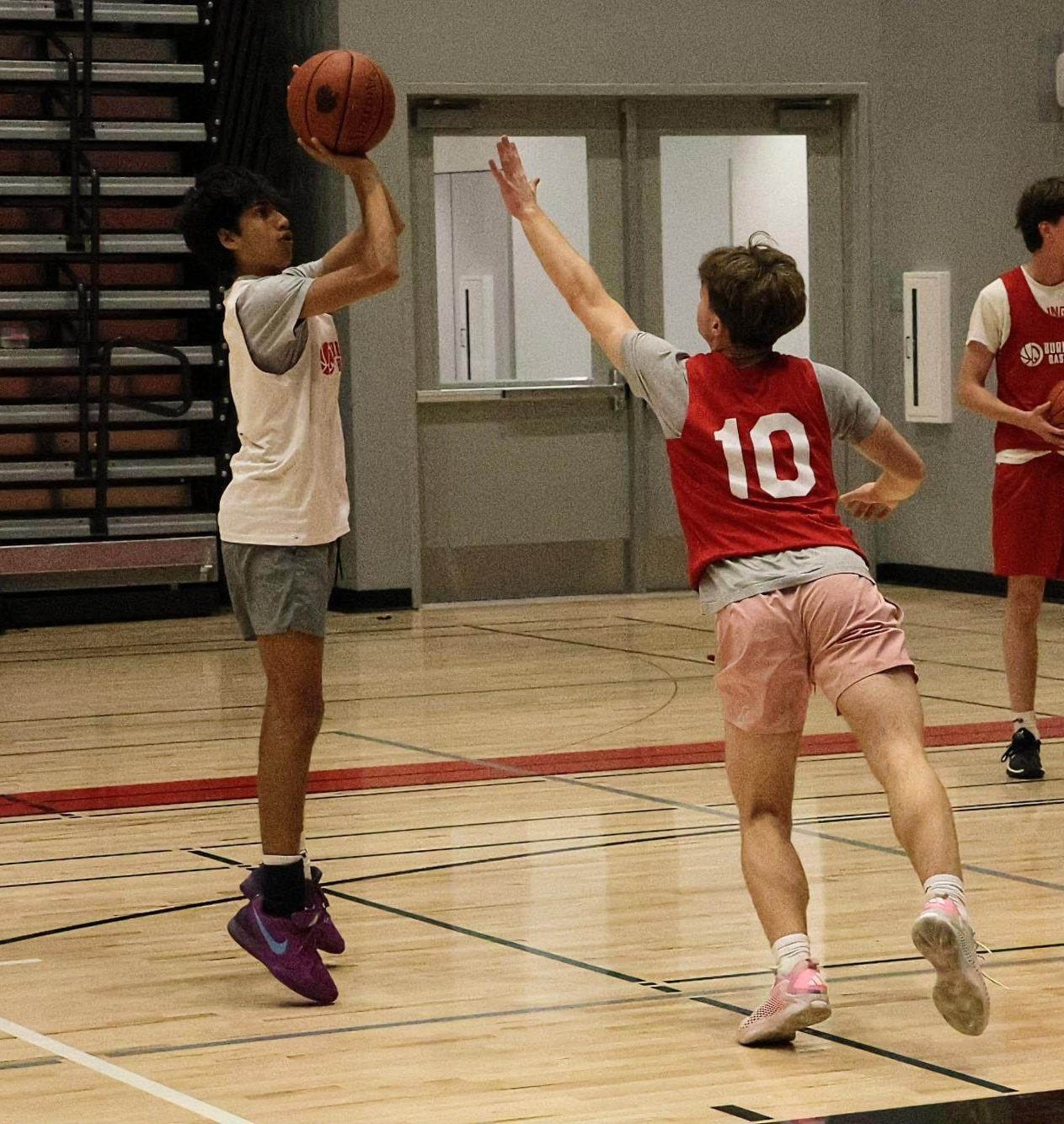 Junior Greg Kazakov plays defense on junior Ethan Philiip during a drill at practice on Nov. 8.