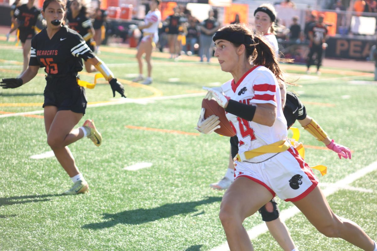 Senior wide receiver Haleh Ansari sprints down the sideline, looking for an opening.