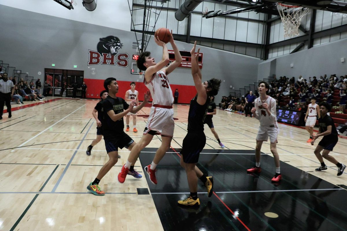 Sophomore Lucca Maher scores a layup.