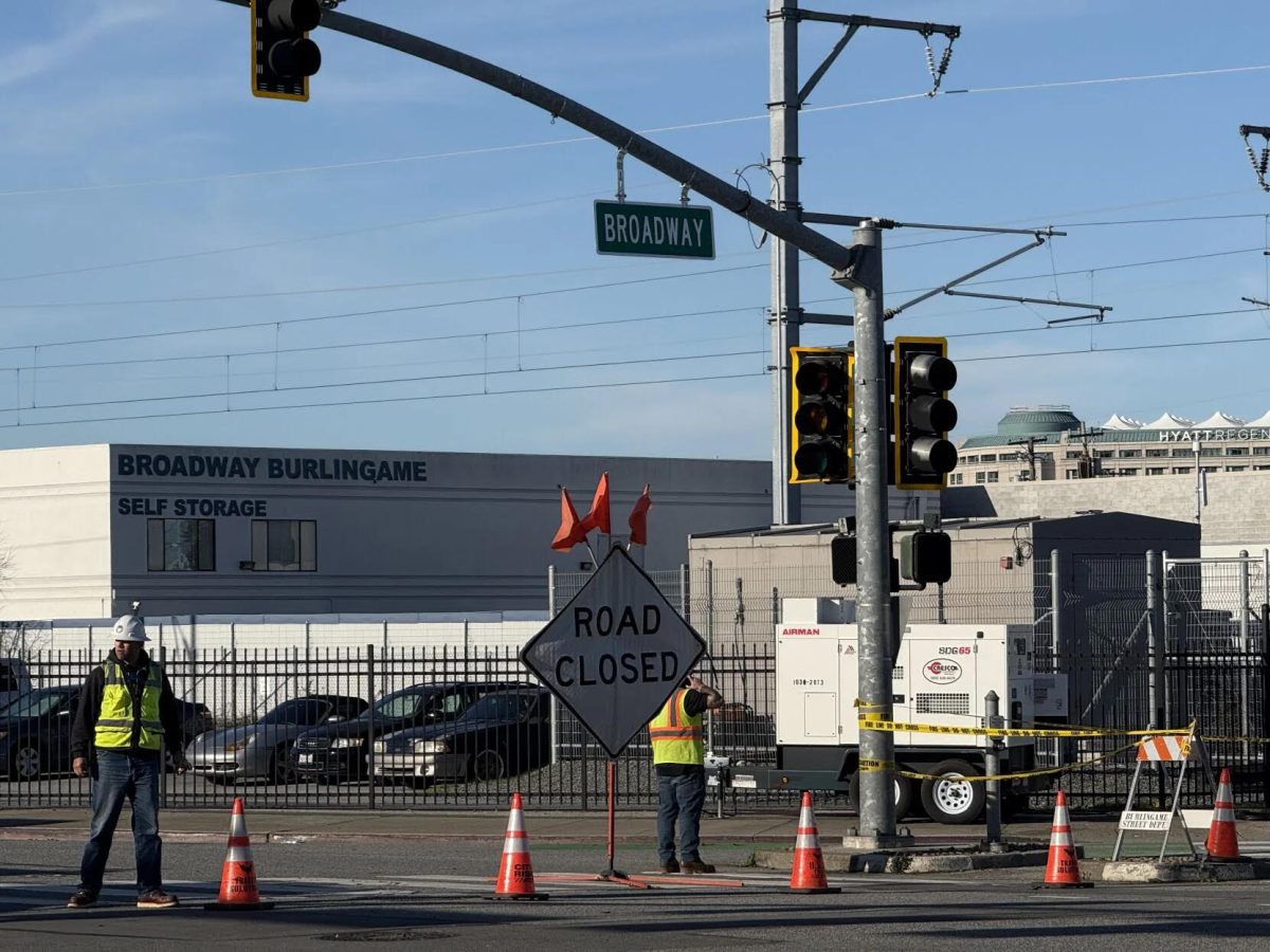 After power outages shut down traffic lights and left businesses and homes without electricity, workers installed a generator on Thursday, Jan. 8, at Broadway and California Drive. Photo courtesy of photographer Ana Mata from the San Mateo Daily Journal, used with permission