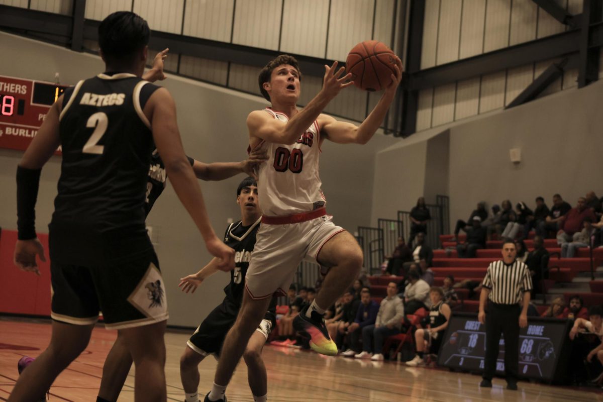 Senior shooting guard Zach Zamalin tries to score a layup.