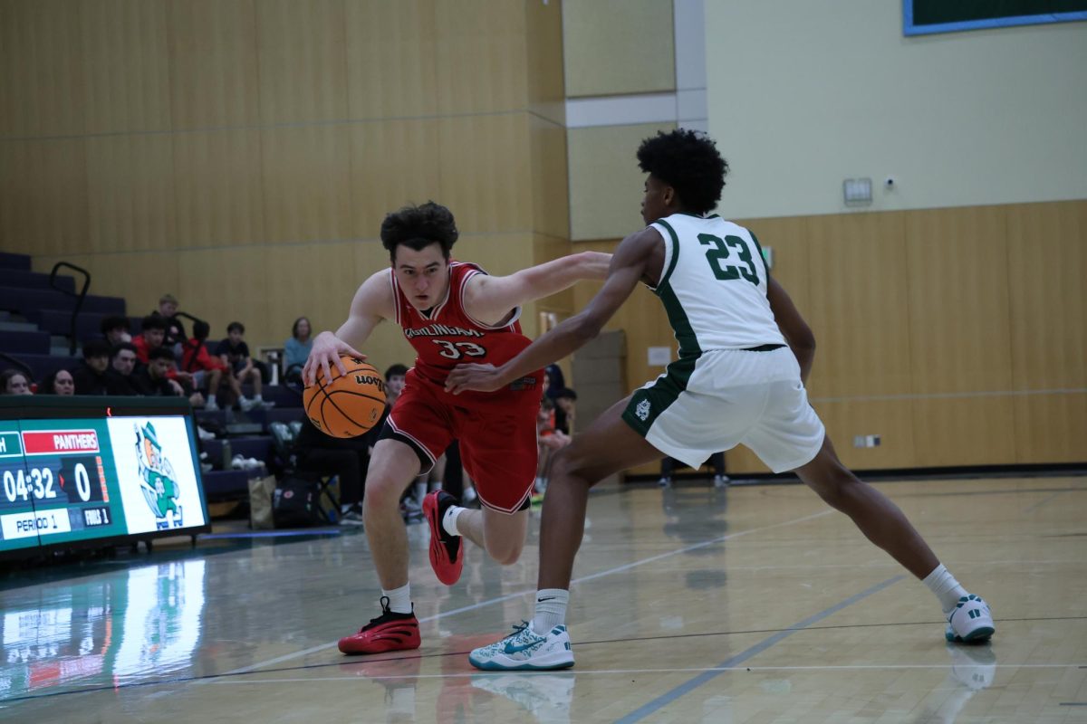 Sophomore Lucca Maher goes for a layup in the first quarter.