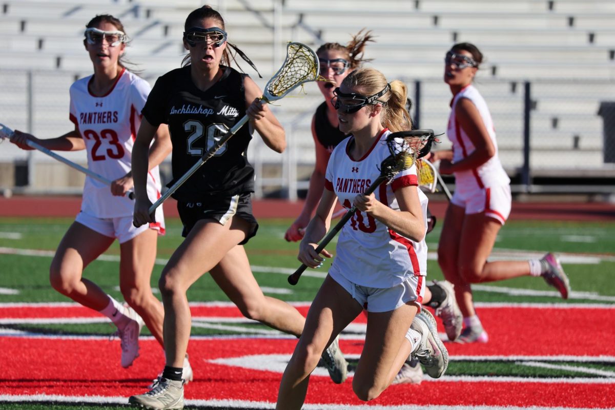 Sophomore Amelia Reeths drives the ball up the field after regaining possession from the opposing player.