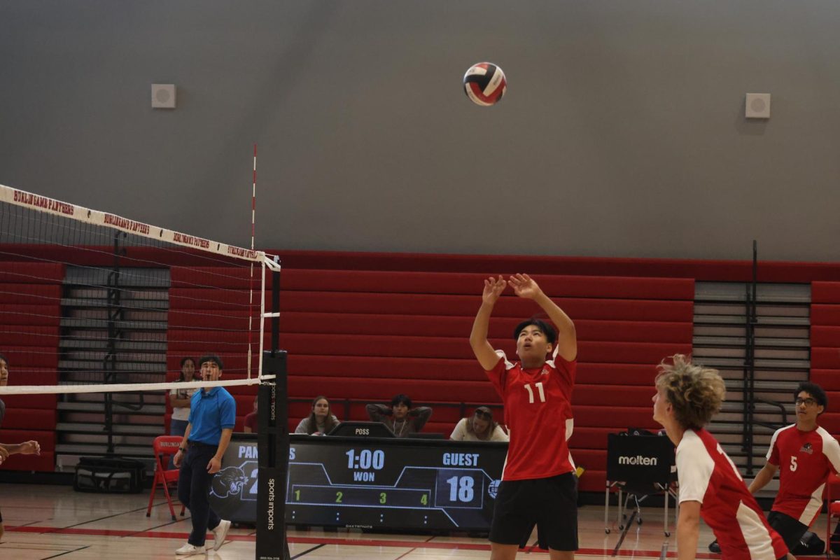 Panthers pass the serve to setter Rowan Chiang, who jumps sets to his outside.