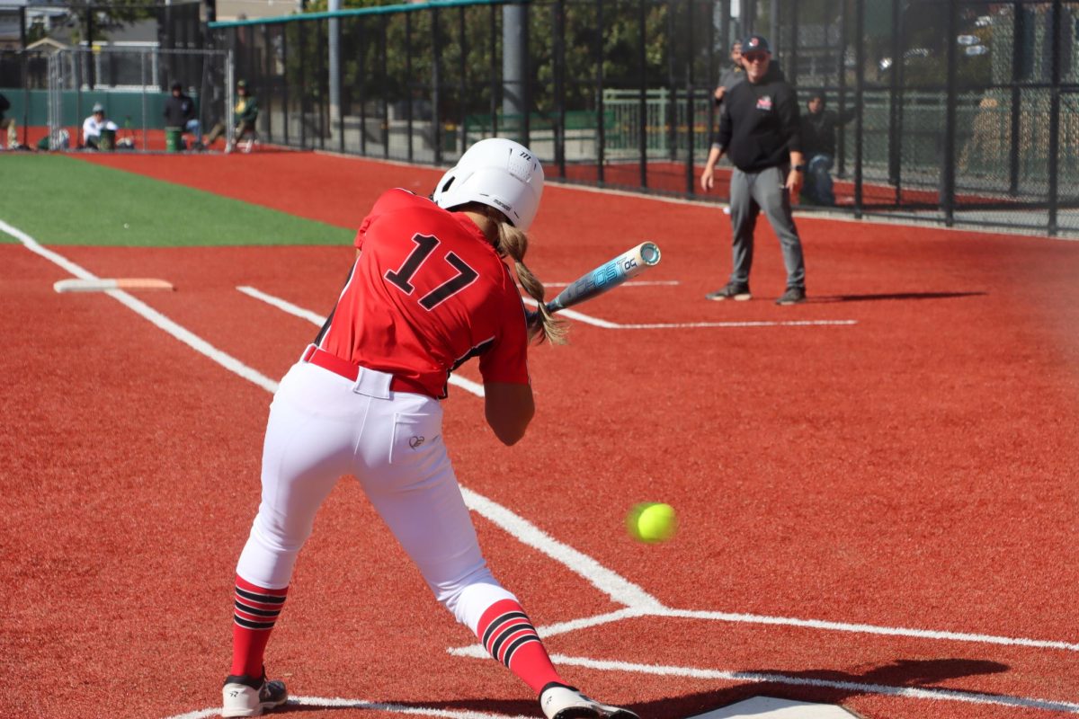 Sophomore pitcher Brooke Arce swings at a ball during the game against Monterey High School at Capuchino High School on Tuesday. Arce hit a triple in the third inning that helped tie up the game.