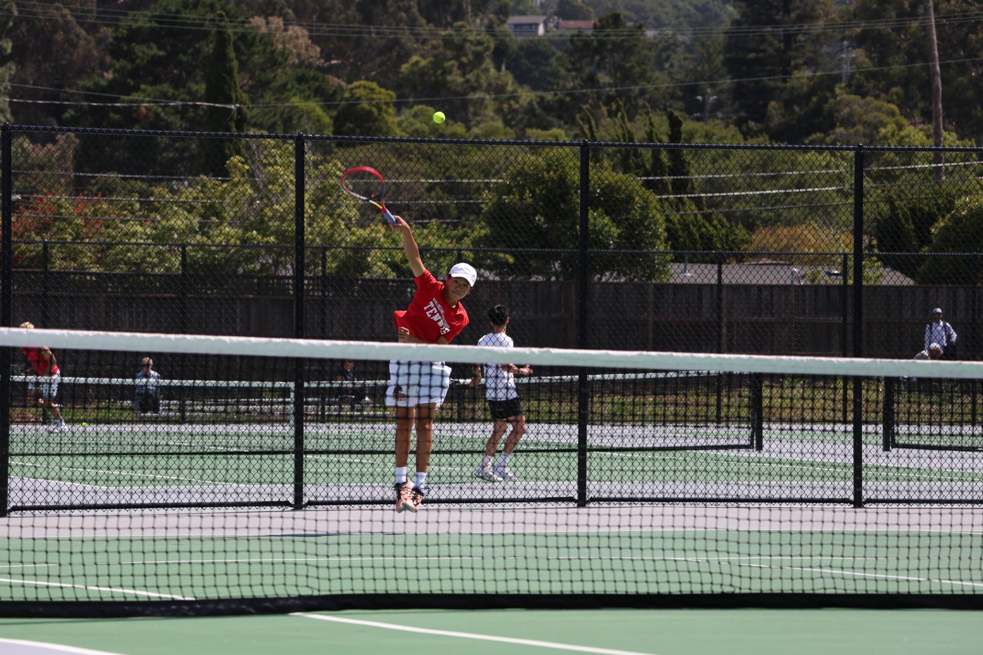 Lam serves the ball to his opponent during the PAL Individual Tournament.