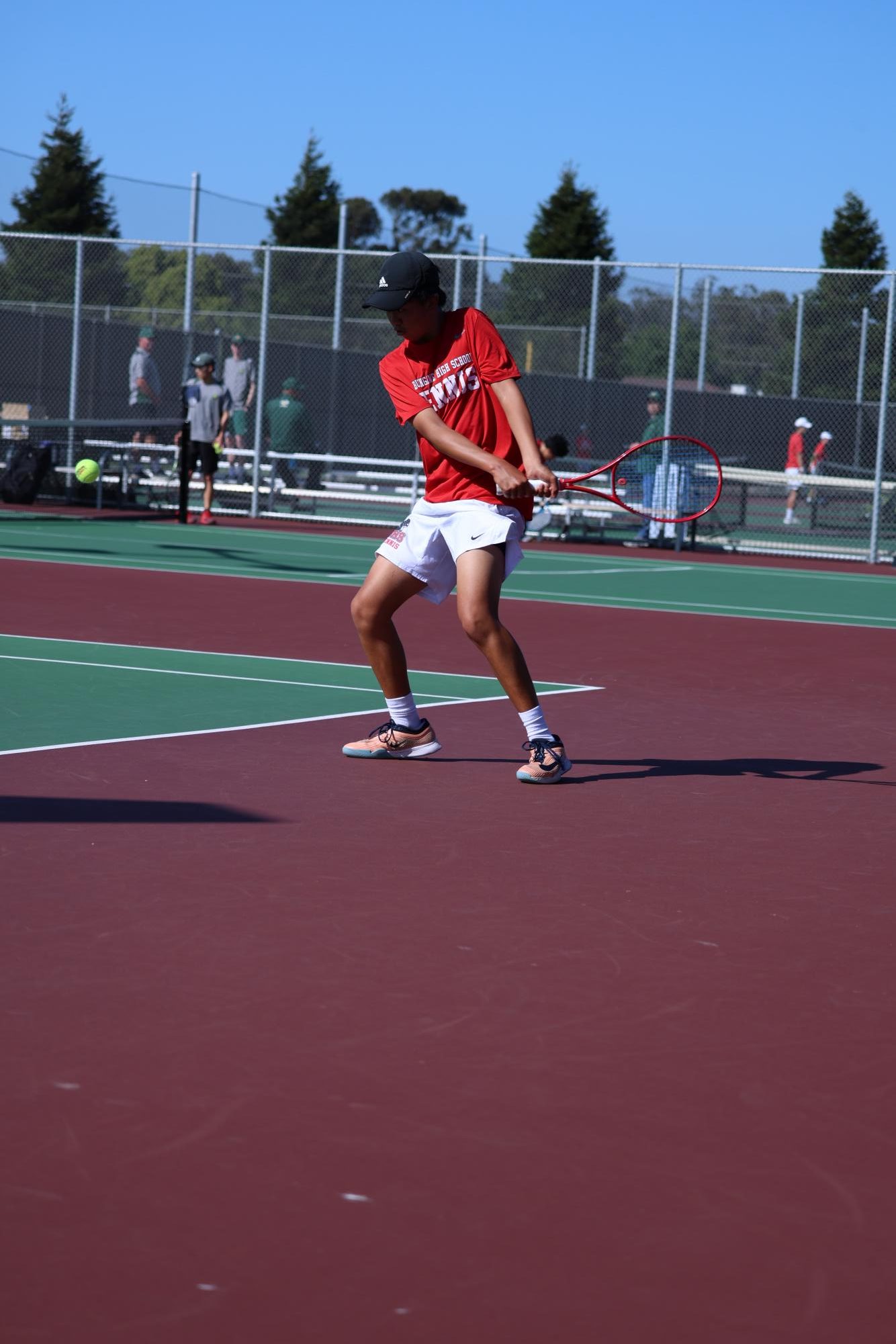 Lam prepares to hit a backhand to return the ball to his opponent during the first round of the CCS Team Tournament against Leigh.