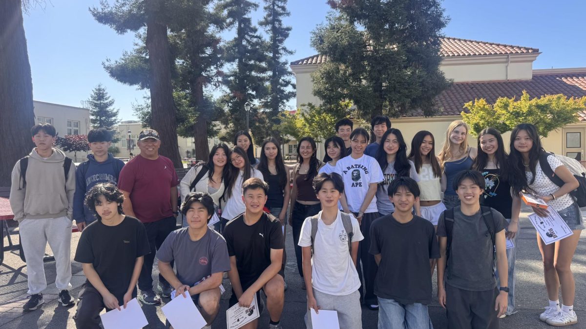 The badminton team poses for a photo following the end-of-season potluck. Photo courtesy of Salvador Banquiles.