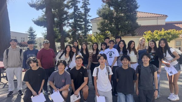 The badminton team poses for a photo following the end-of-season potluck. Photo courtesy of Salvador Banquiles.