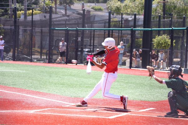 Senior catcher Oscar Osuna swings at a pitch during the Saturday, May 23 game against Leigh High School.